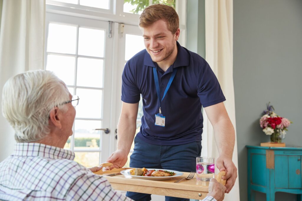 Social care worker with tray